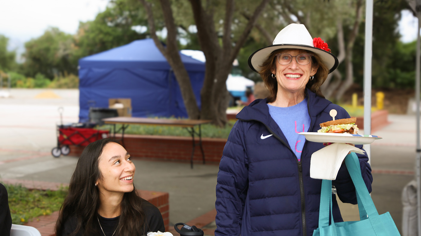 Attendee enjoying a meal from the foodshare
